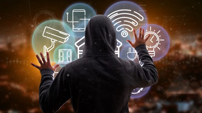 View,Of,Hacker,Man,Holding,Smart,Home,Interface,With,Icon,